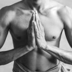 Hands pressed together in anjali mudra, the gesture that accompanies namaste